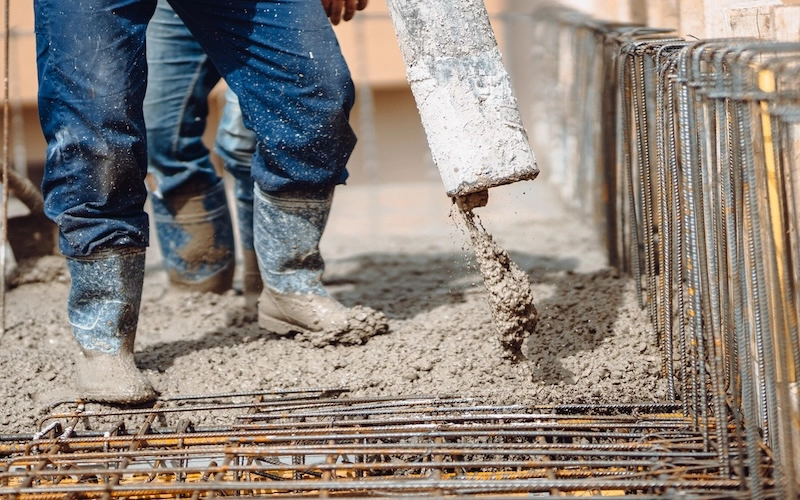 men pouring concrete